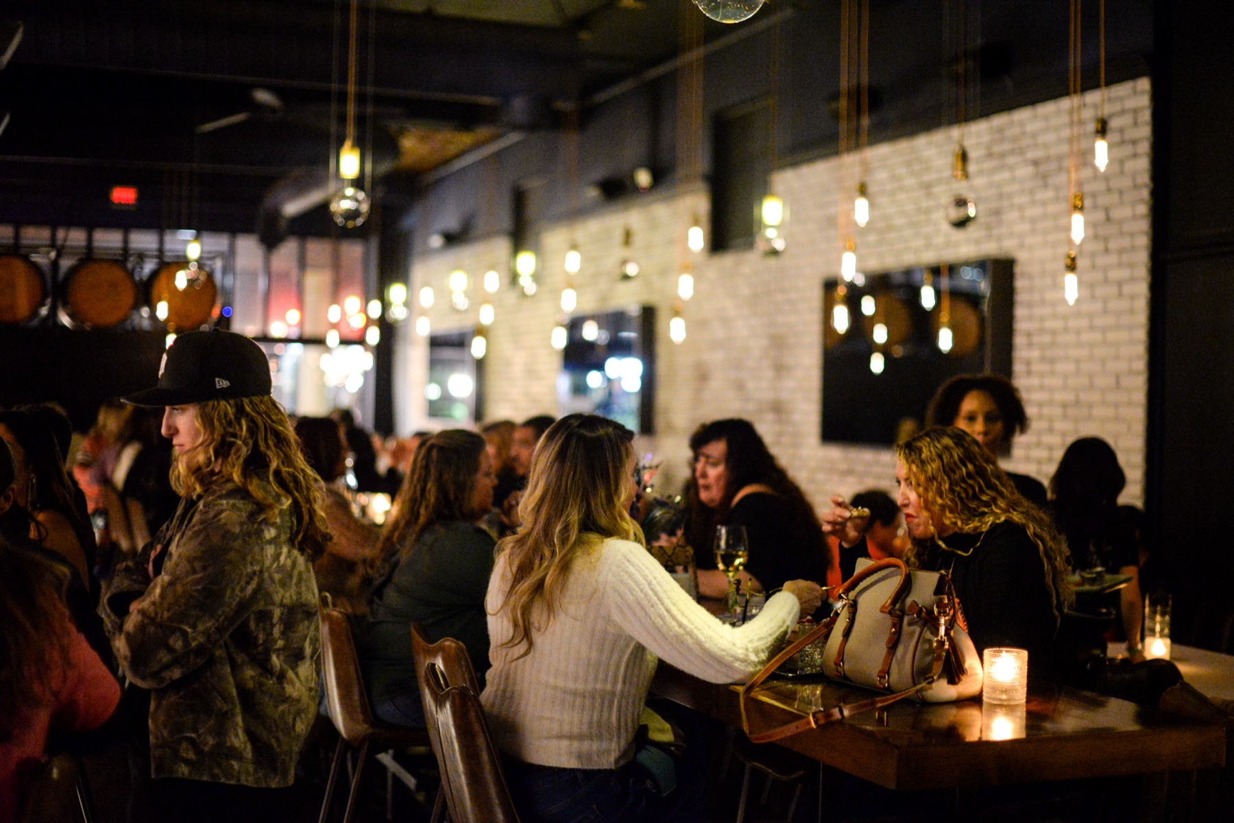 Guests sharing food, wine and conversation at BlackSheep